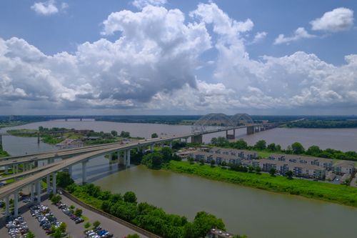 Free Scenic aerial view of the Hernando de Soto Bridge over the Mississippi River in Memphis, TN on a summer day. Stock Photo