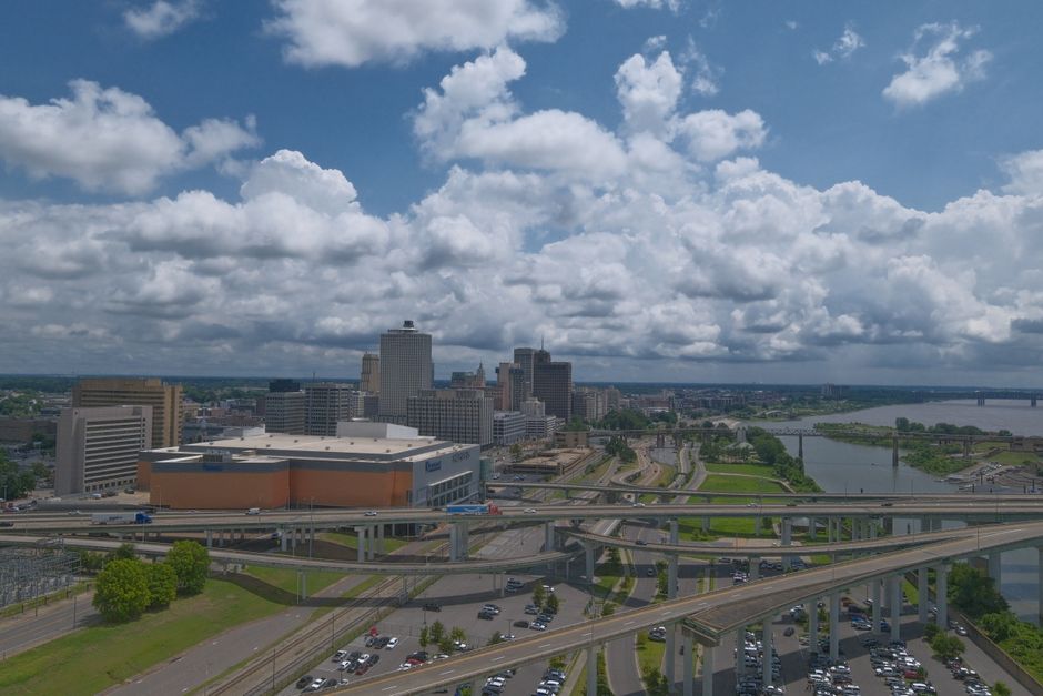 Aerial view of downtown Memphis, Tennessee with highways and skyline on a cloudy day.