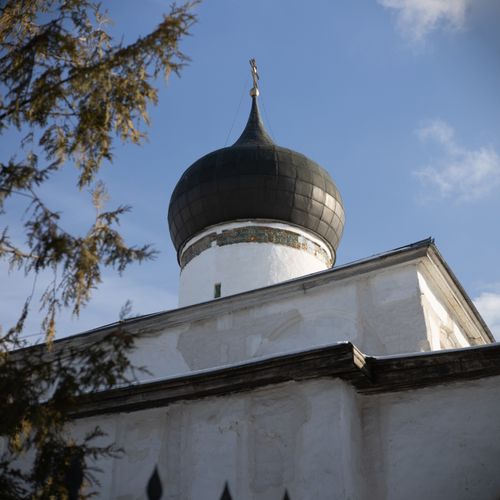 Free A historic Orthodox church with a distinct dome, showcasing architectural beauty under a clear blue sky. Stock Photo