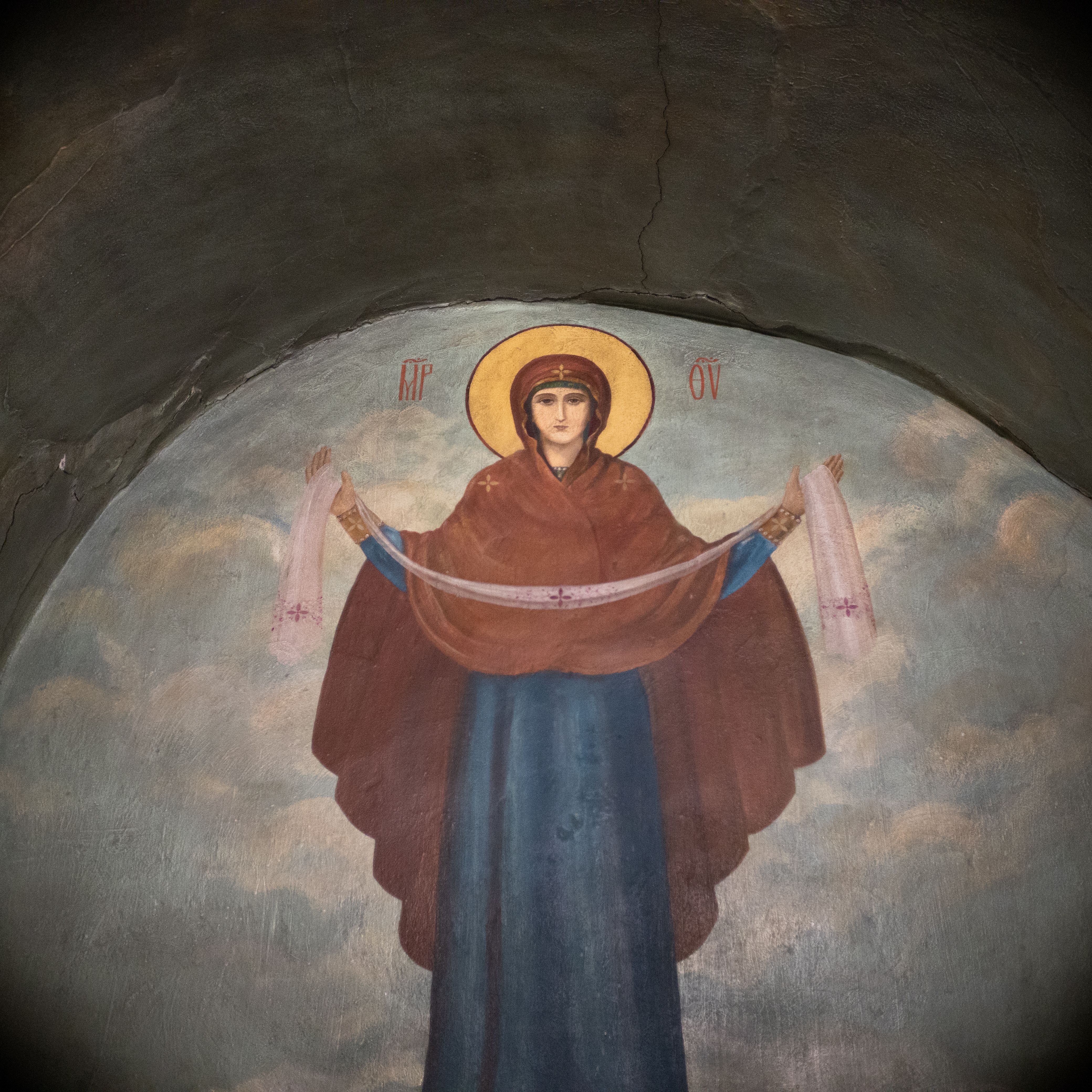A captivating mural of the Virgin Mary in a historic church setting.