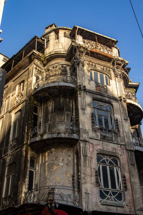Free Ornate historic building with intricate details against a blue sky. Stock Photo