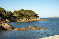 Stunning view of rocky coastline and clear blue sea in Hyères, Provence.