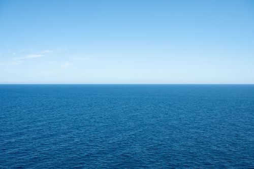 Free Vast expanse of blue sea meeting clear sky, captured in Provence, France. Stock Photo