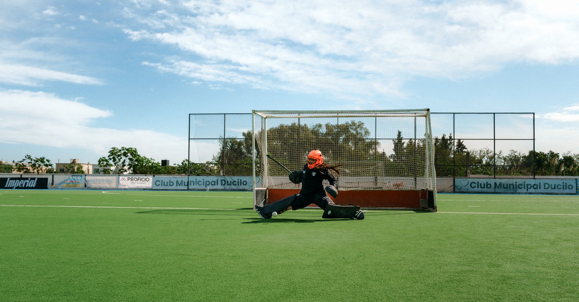 Goalkeeper making a save on a sunny day at Club Municipal Ducilo field.
