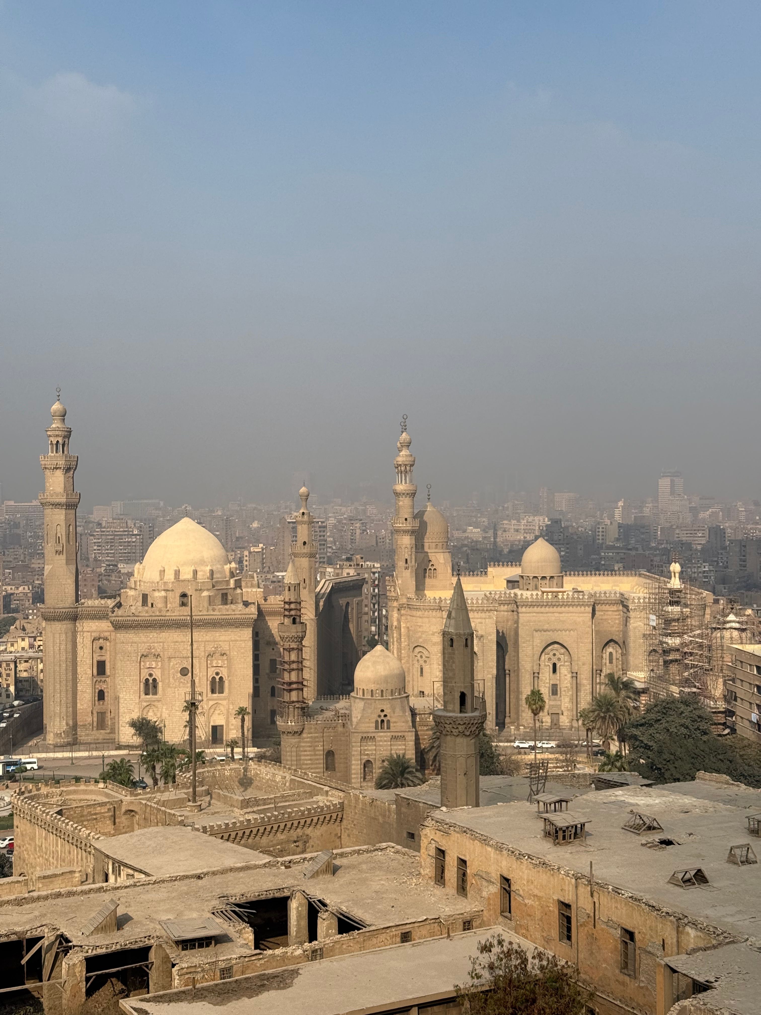 Stunning aerial shot of Cairo's Sultan Hassan Mosque displaying historic Islamic architecture.