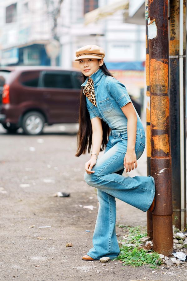 Woman wearing double denim with a denim skirt on the street
