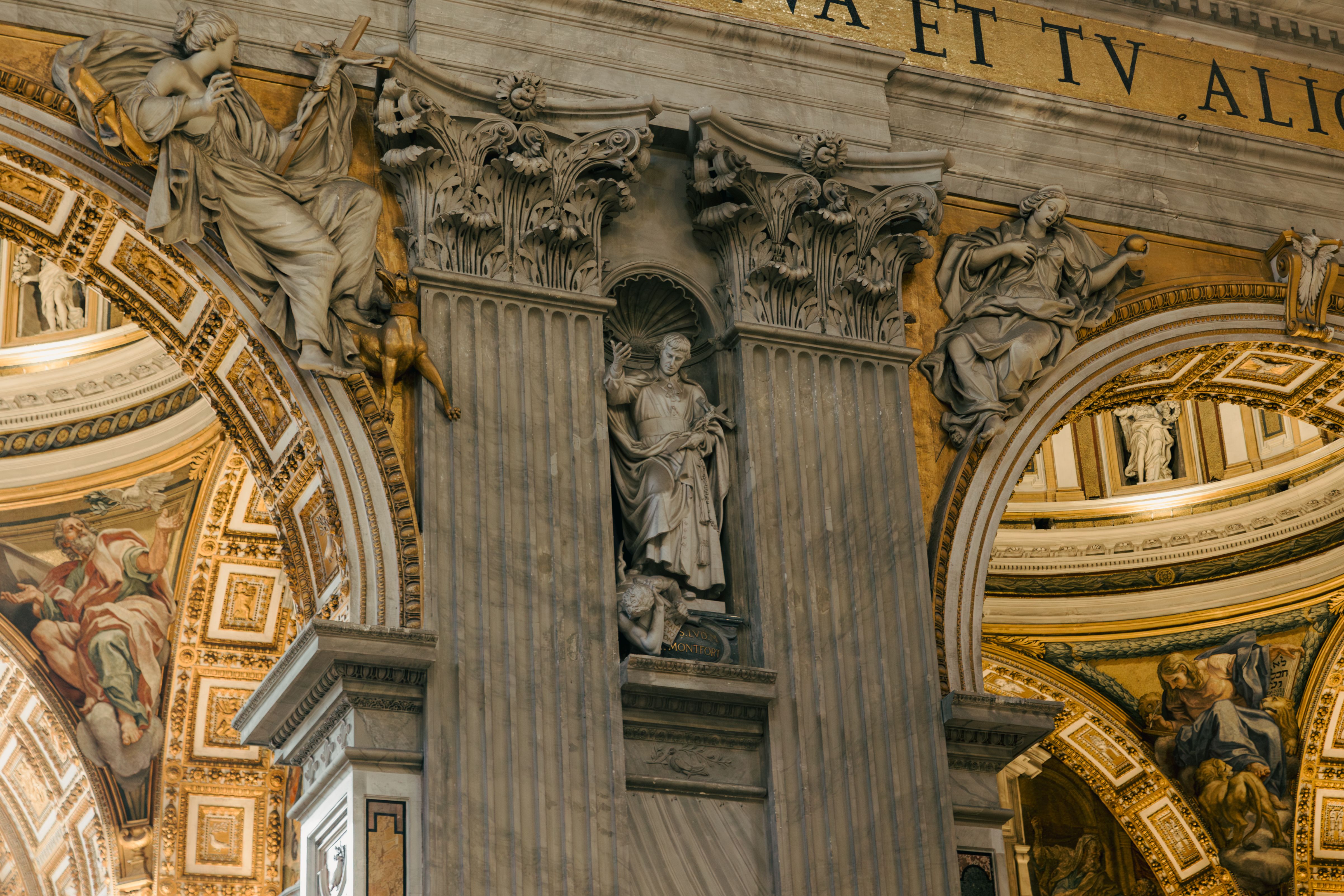 Intricate sculptures and ornate details inside St. Peter's Basilica in Vatican City.