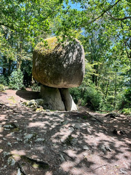 Free Mysterious rock formation in the Huelgoat Forest, Bretagne, France, surrounded by lush greenery. Stock Photo