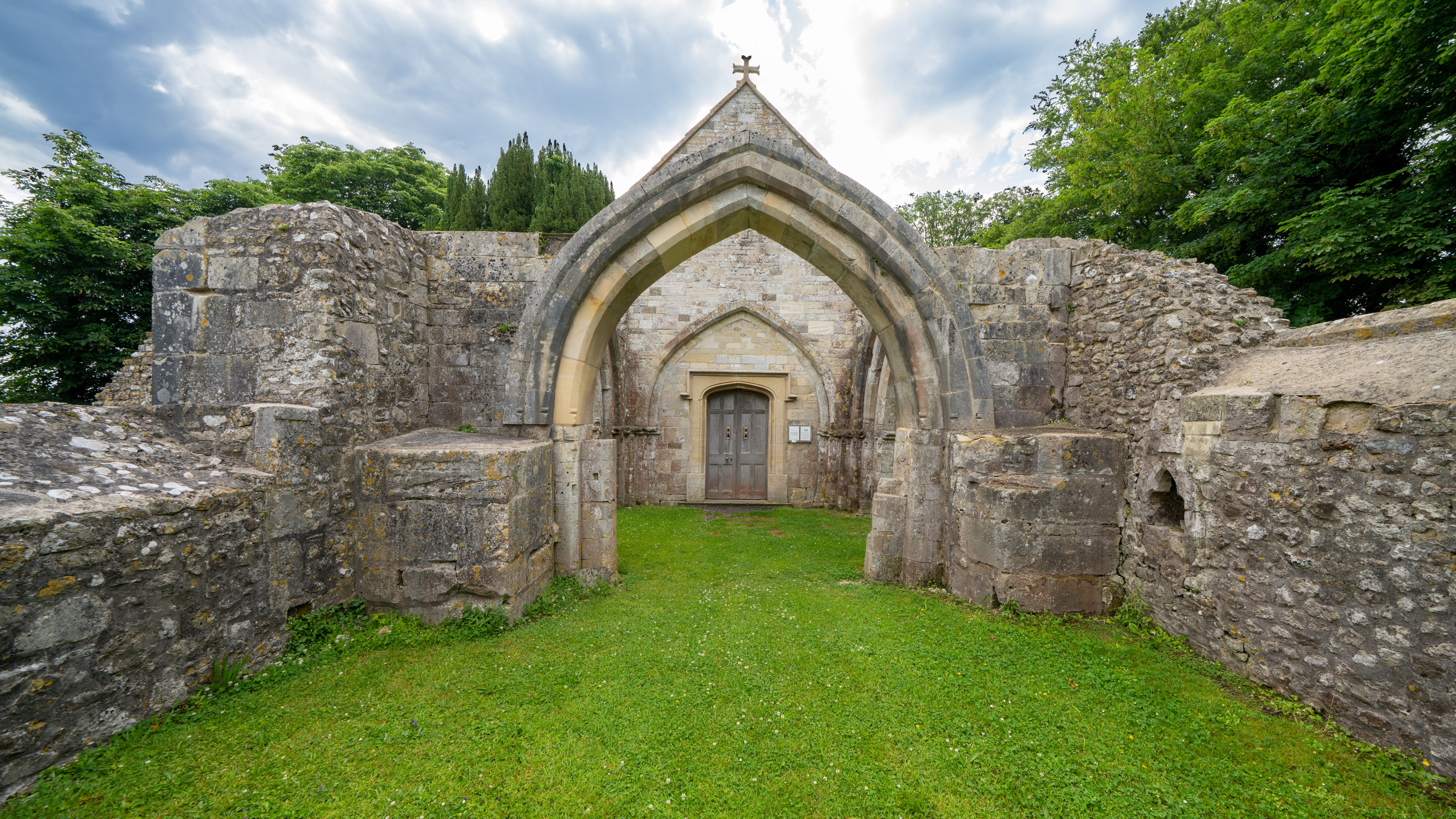 Explore the historic church ruins in Sutton Veny, showcasing ancient architecture in a serene rural setting.