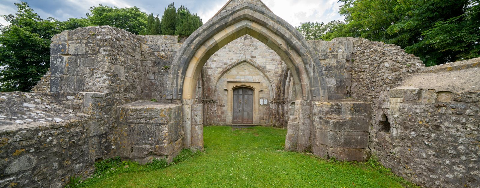 Explore the historic church ruins in Sutton Veny, showcasing ancient architecture in a serene rural setting.