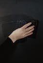 Person Erasing the Chalkboard