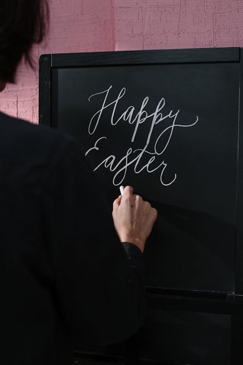Free Person Writing on Chalkboard Stock Photo
