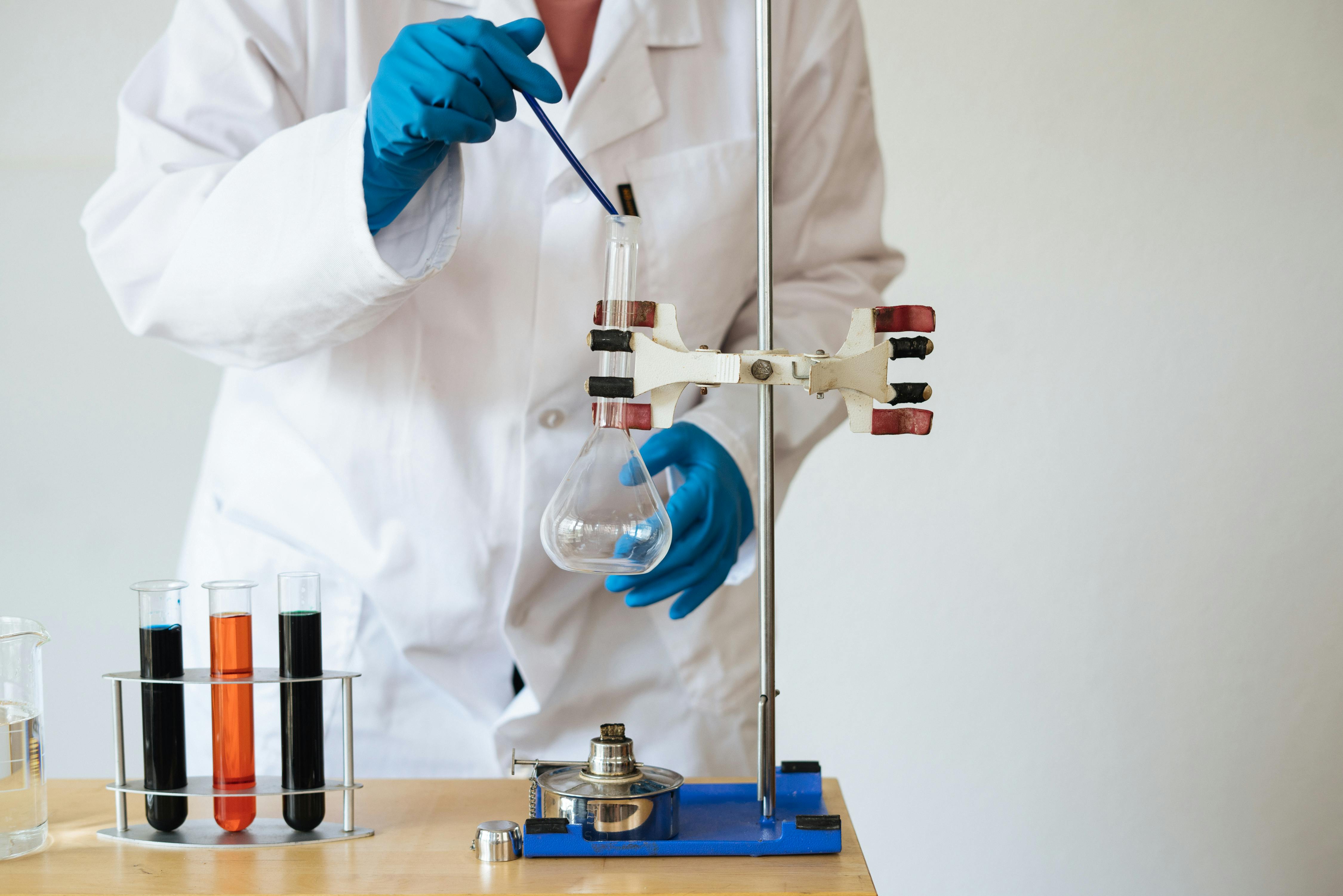 faceless-laboratory-technician-conducting-chemical-test-free-stock-photo