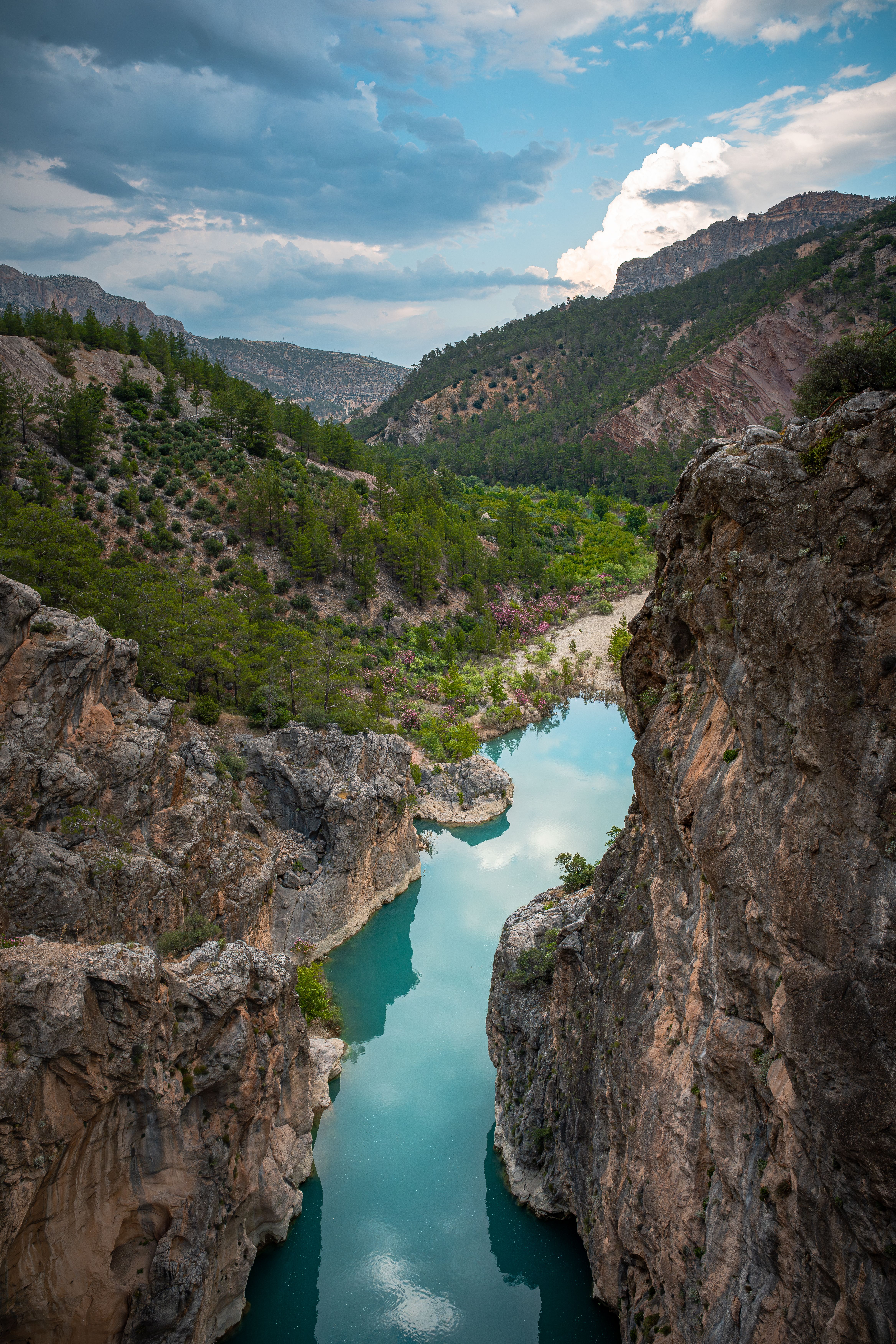 Breathtaking view of a turquoise river winding through a rocky canyon in Mersin, Türkiye.