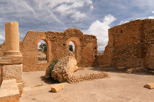 Free Explore the ancient ruins in Tunisia showcasing historical architecture amidst a scenic backdrop. Stock Photo