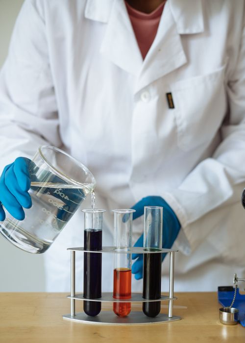 Close-up of chemical reagent testing at Syrohchem's R&D centre