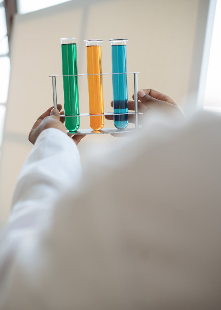 Crop Laboratory Technician Conducting Biochemical Experiment With Liquids In Science Center