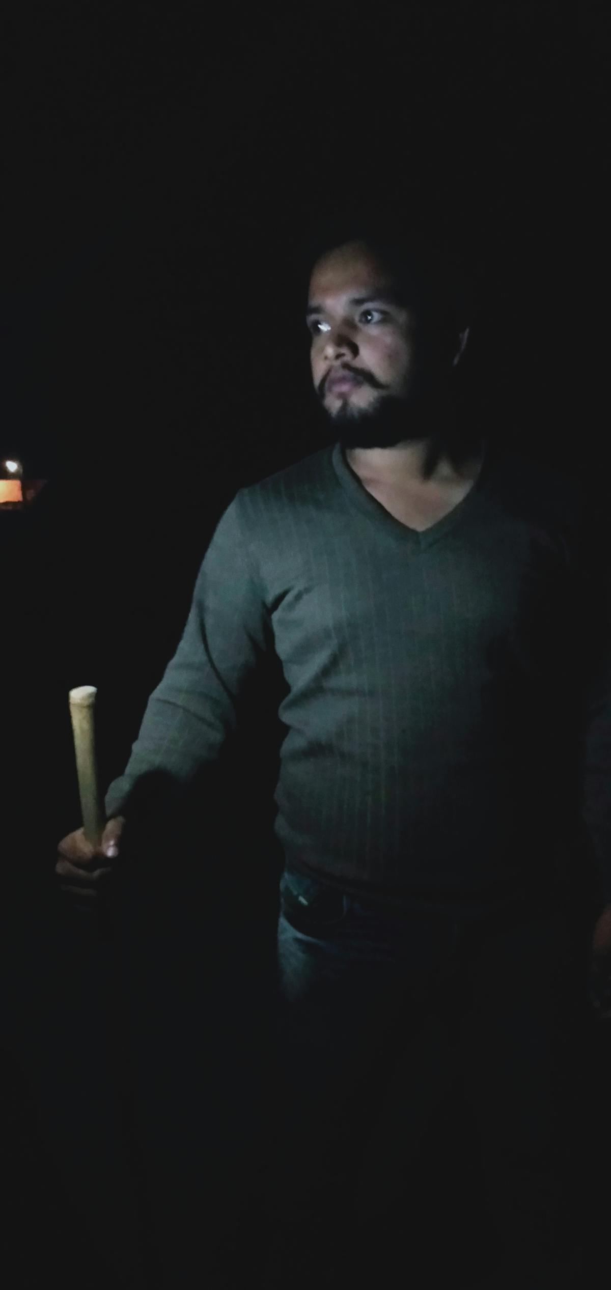 Developer working with 3D content and code on multiple displays