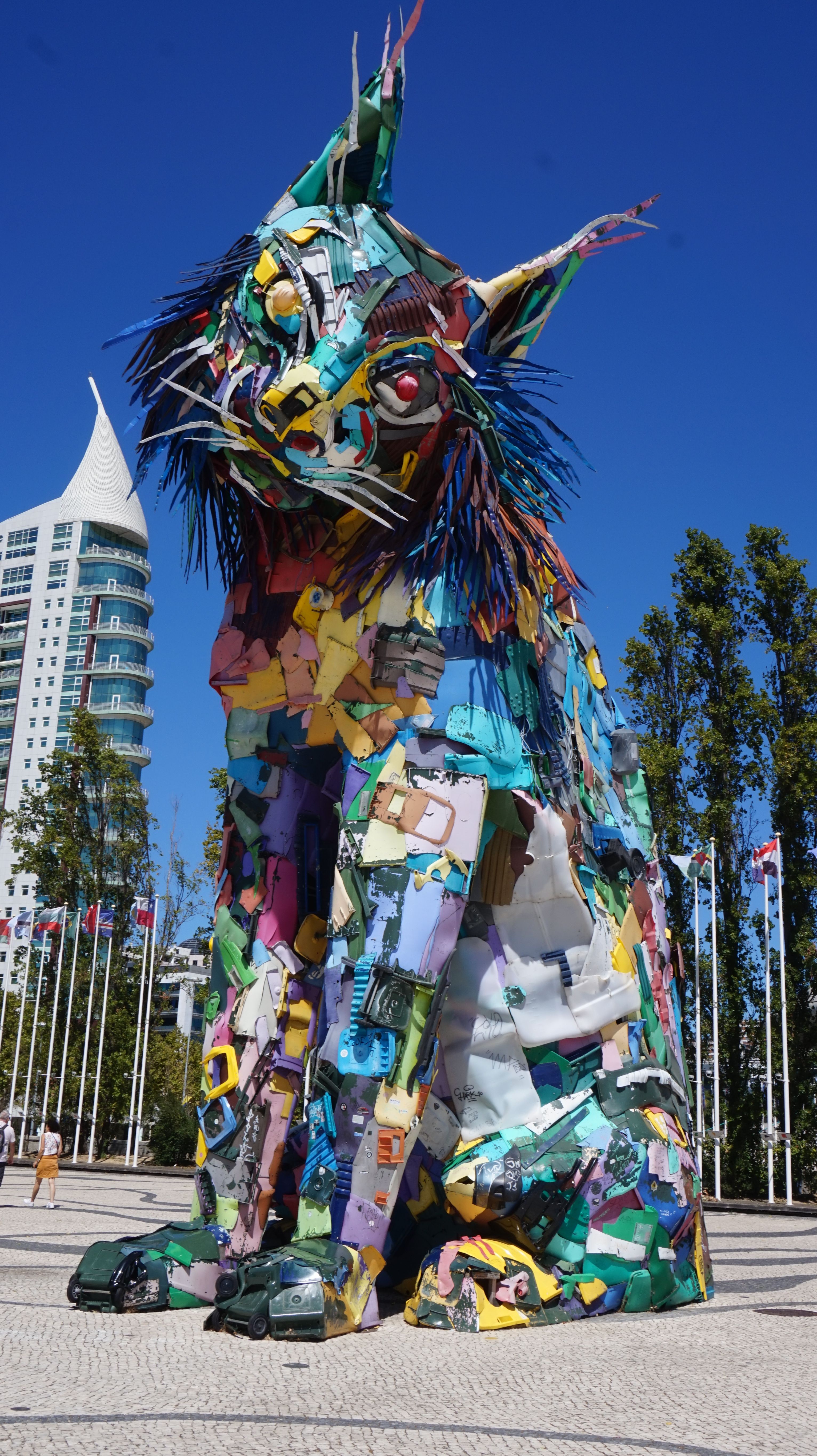 Eccentric cat sculpture made from trash, towering in Lisbon, Portugal.