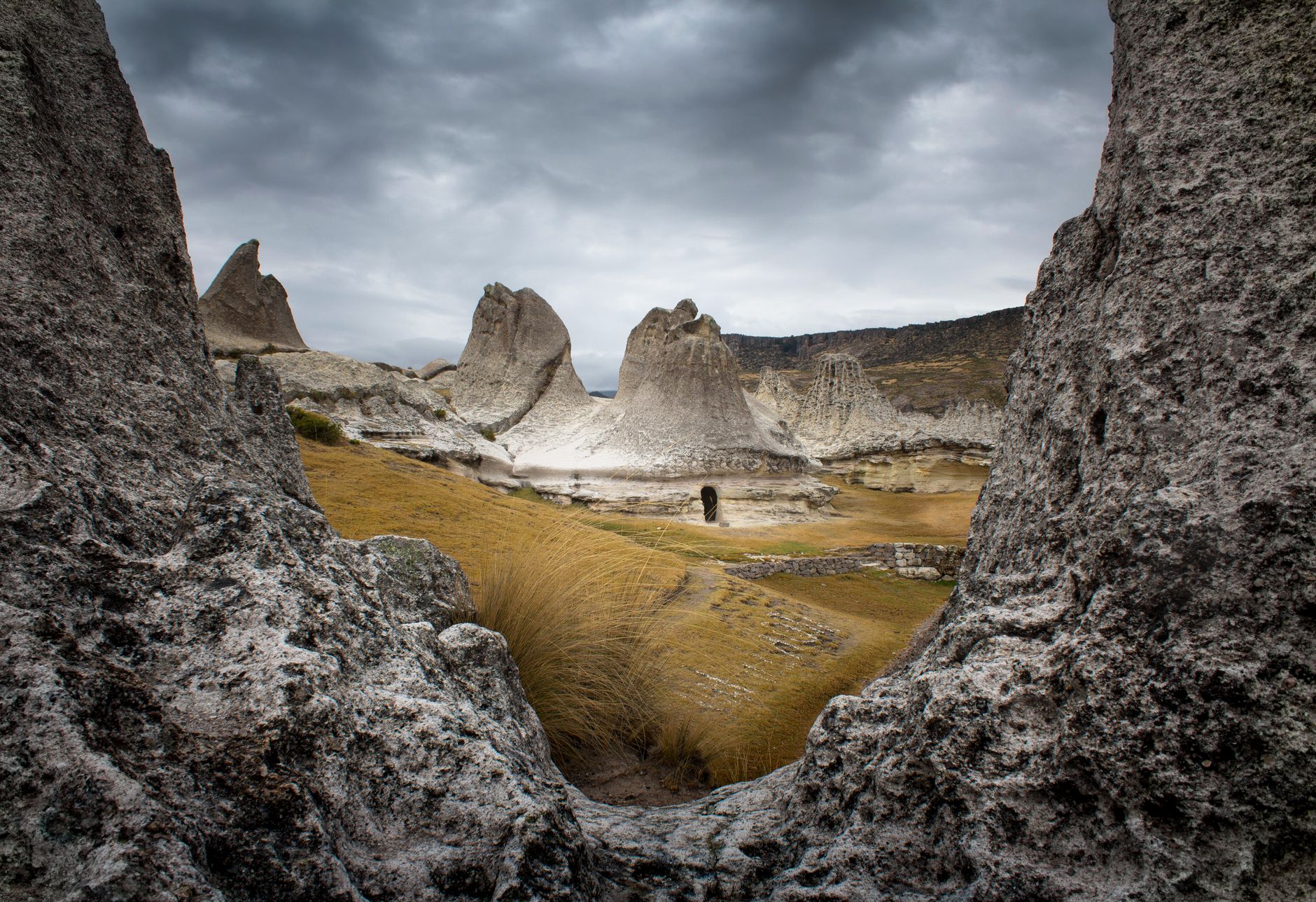 Explore the unique rock formations in Andahuaylas, Apurímac, surrounded by dramatic landscapes.