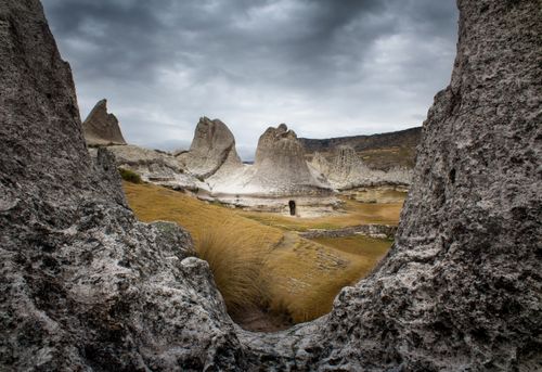 Free Explore the unique rock formations in Andahuaylas, Apurímac, surrounded by dramatic landscapes. Stock Photo