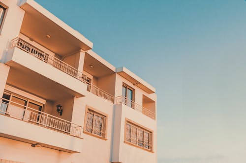 Free Orange Concrete Building Under Blue Sky Stock Photo