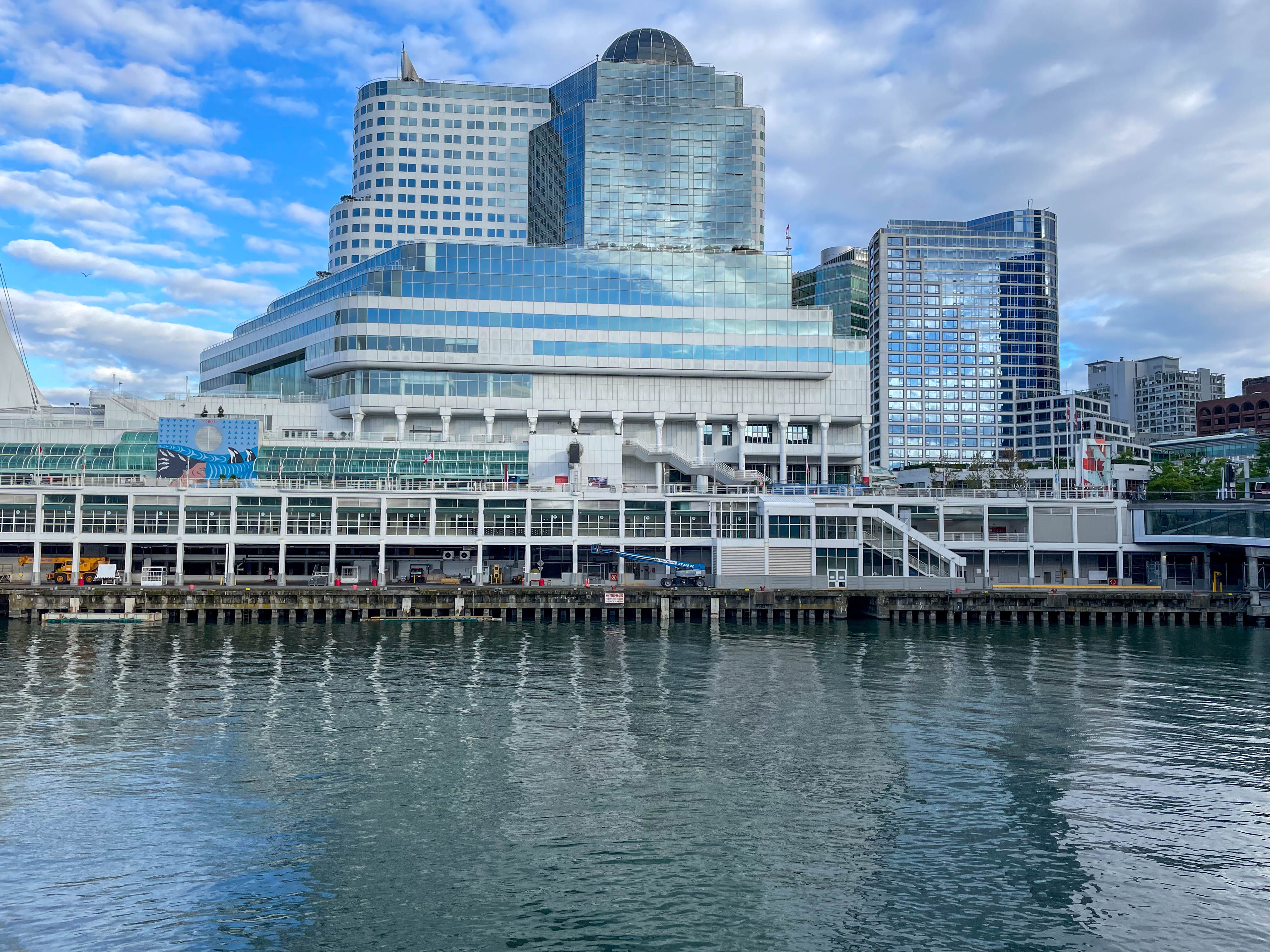 Downtown Waterfront View of Iconic Skyscraper · Free Stock Photo