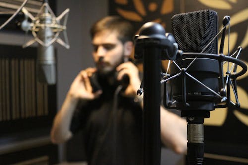 Free Close-Up Shot of a Condenser Microphone in a Music Studio Stock Photo