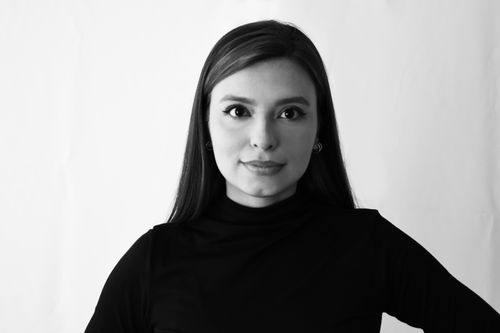Free Black and white portrait of a woman with long hair wearing a black top. Stock Photo