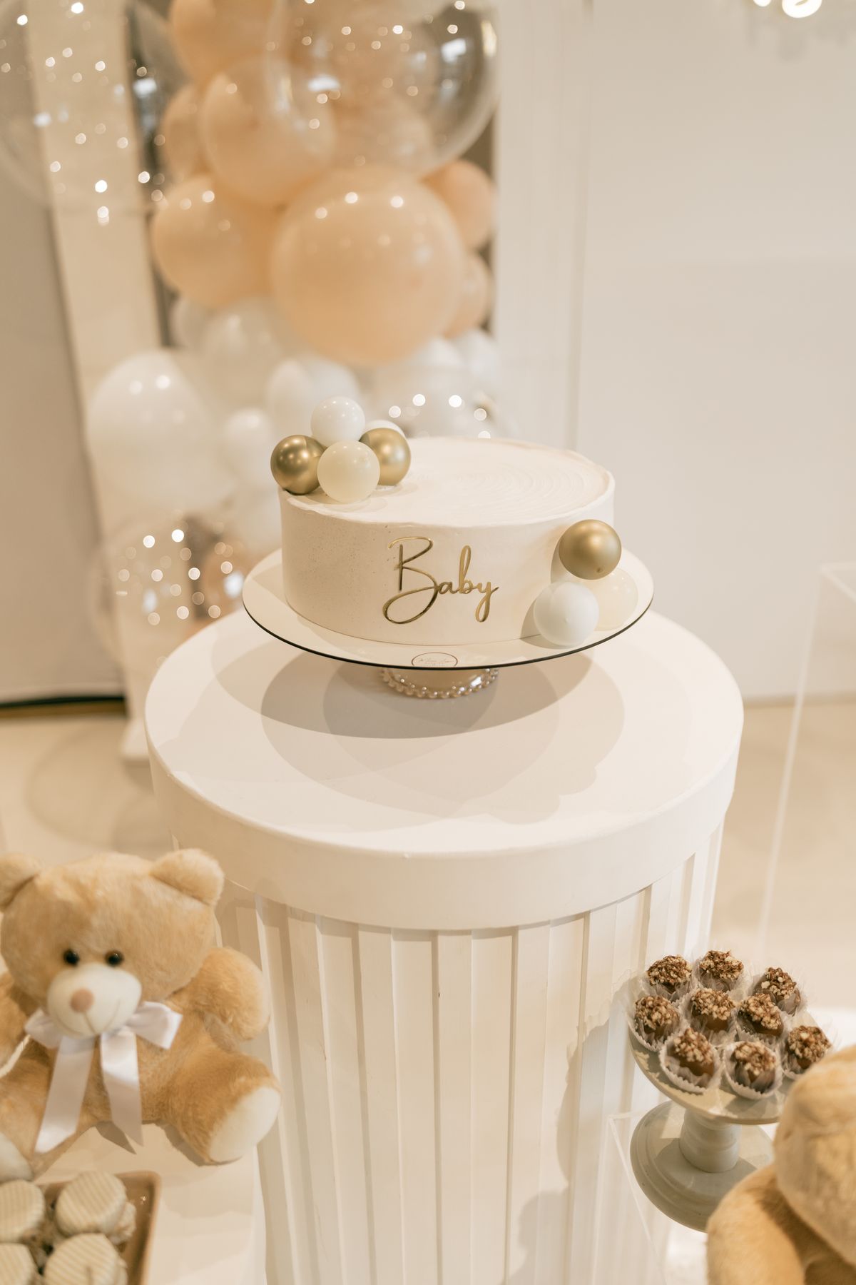 Baby shower cake with balloons and teddy bear decoration