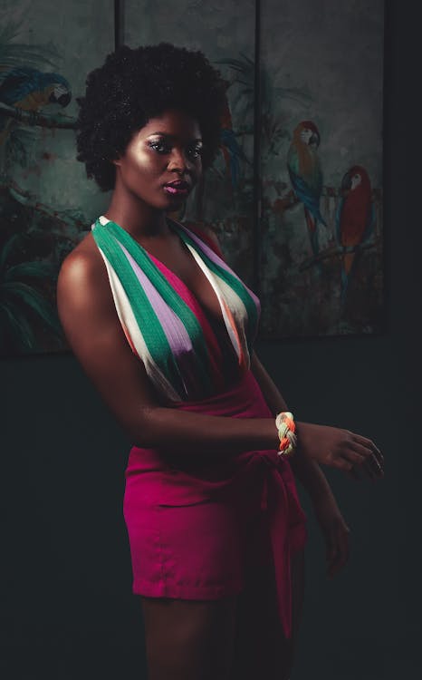 Woman in Multicolored Sleeveless Dress Standing