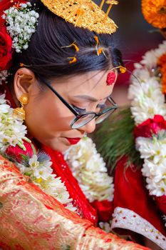 Beautiful bride adorned in traditional attire and jewelry, capturing the essence of a cultural wedding ceremony.