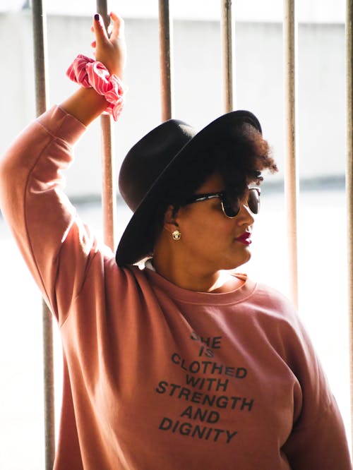 Free Woman in Pink Longsleeve Wearing Sunglasses and Black Hat Stock Photo