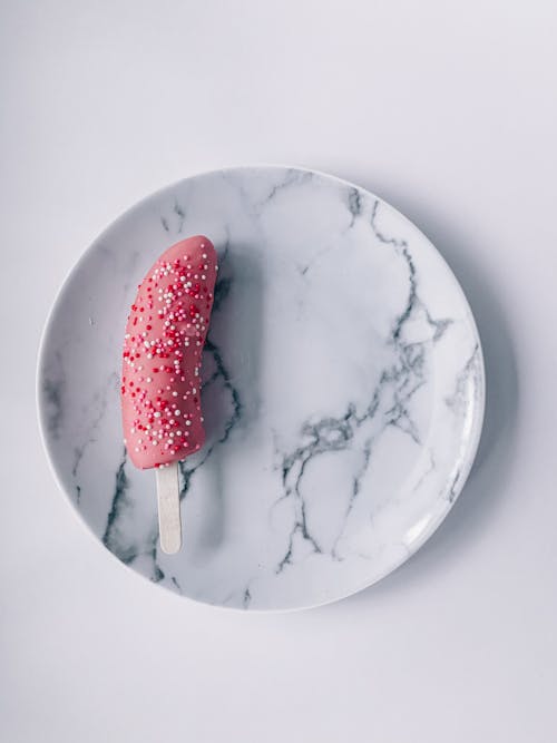 Ice cream placed on plate on white background