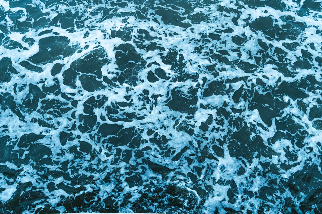 Fondo De Agua De Mar Azul Agitando Espumosa