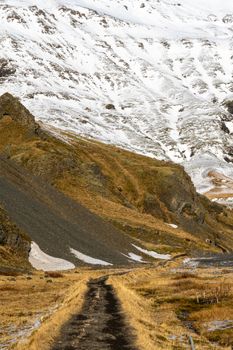 Explore a scenic hiking trail leading to snow-covered mountains, ideal for nature enthusiasts.