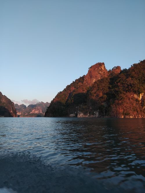 Free Tranquil view of mountains and lake at sunset, capturing the natural beauty and serenity. Stock Photo
