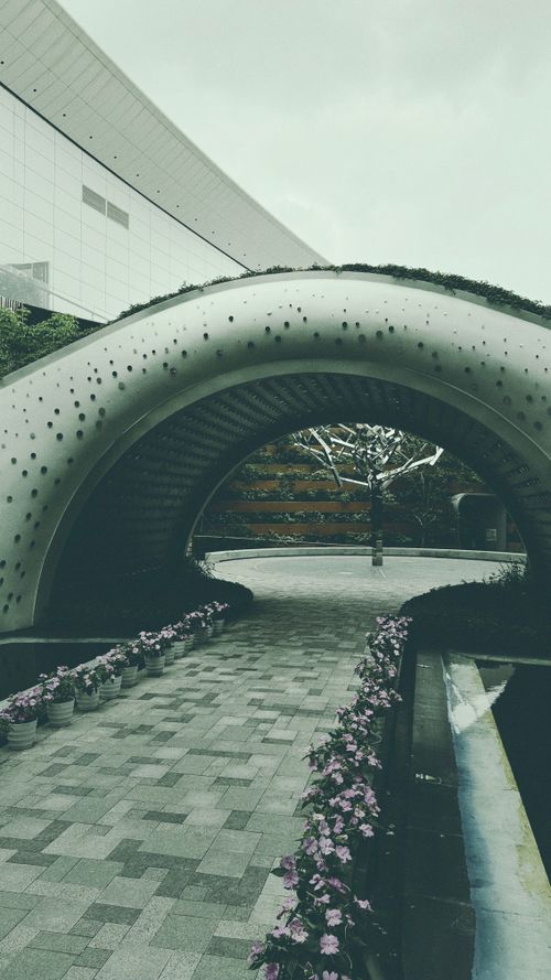 Free A contemporary architectural archway adorned with plants in Guangzhou, China. Stock Photo