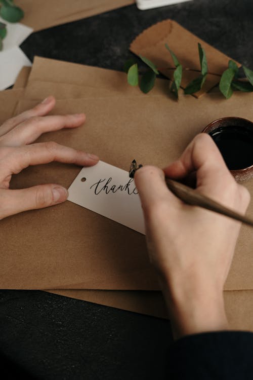 Free Person Writing On A Tag Stock Photo