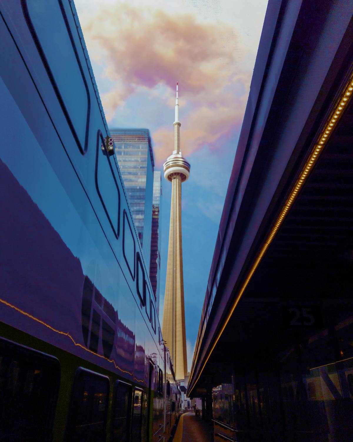 Bullet journal with pens laid out neatly beside a laptop