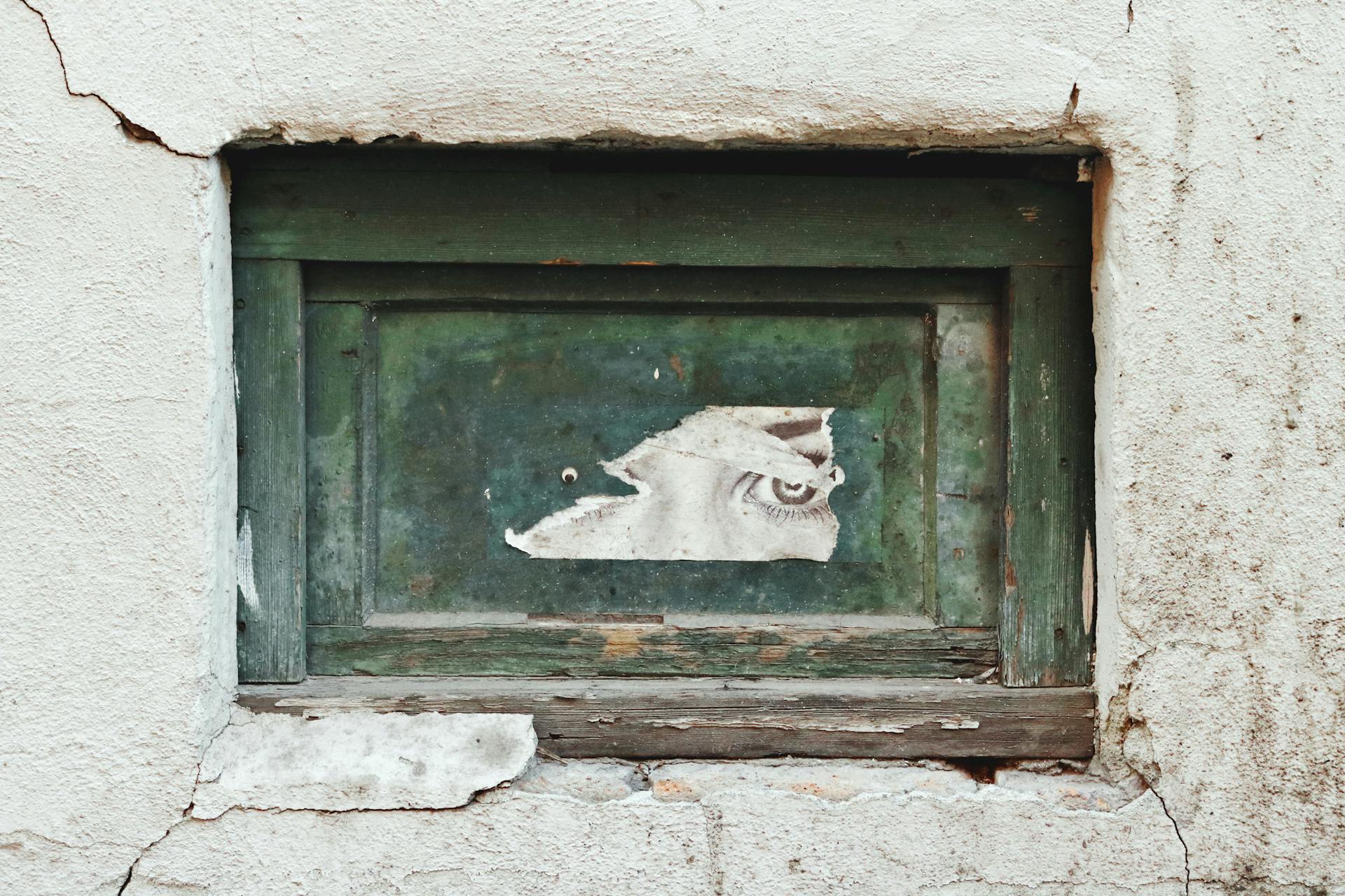 Eye Print on Wooden Frame in the Wall