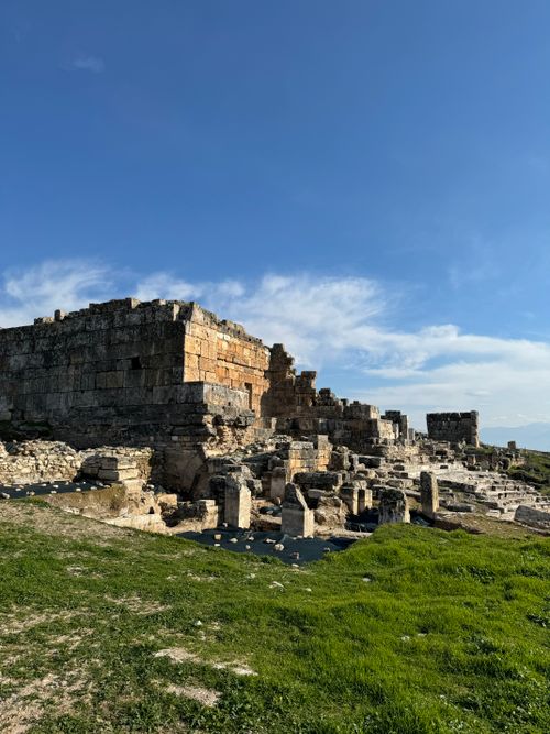 Free Explore the ancient Roman ruins under a clear blue sky in Pamukkale, Turkey. Stock Photo