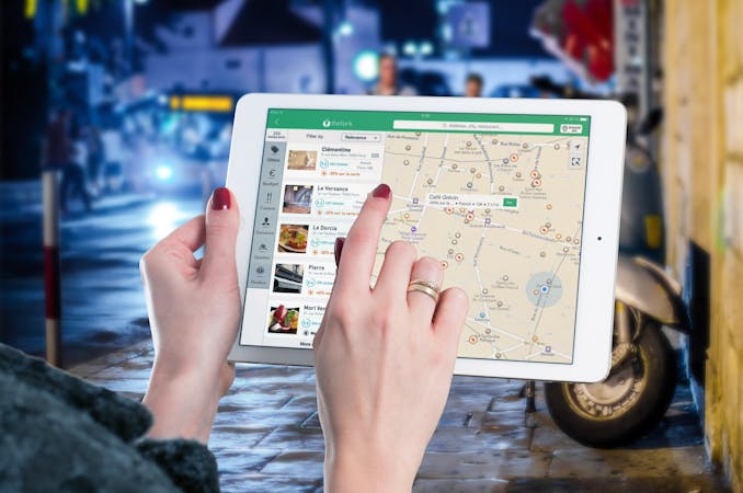 Hands using a digital map . ranking google business profile seo