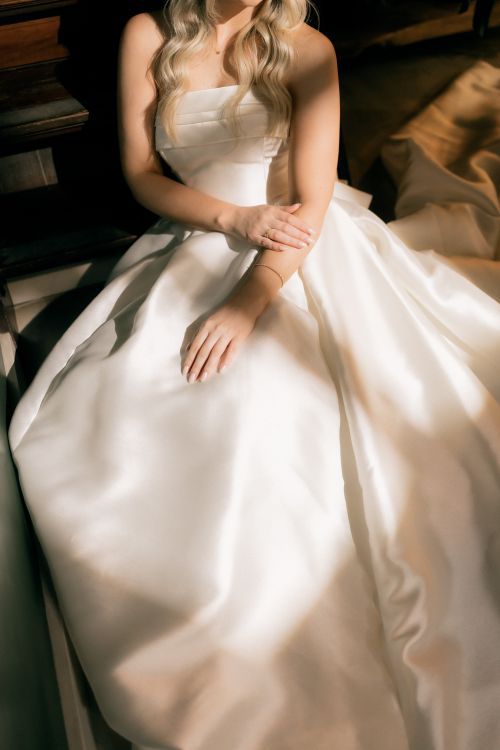Free Beautiful bridal gown with elegant details, captured in soft lighting. Stock Photo