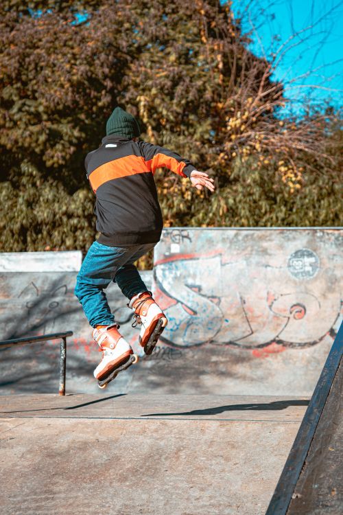 Free Skateboarder performing a jump at a vibrant skatepark in Buenos Aires. Stock Photo