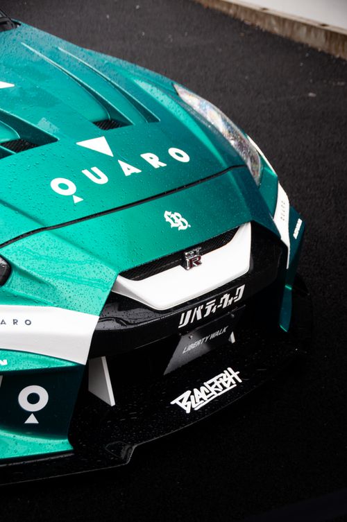 Free Close-up of a custom-designed Nissan GTR in central Tokyo, showcasing automotive artistry. Stock Photo