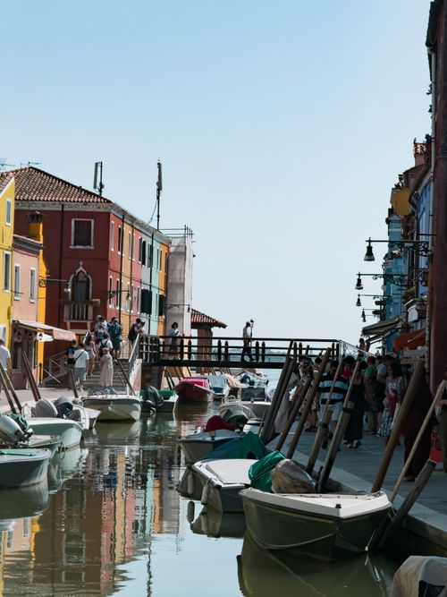 Free Charming view of the vibrant canal and iconic colorful buildings in Burano, Venice, Italy. Stock Photo