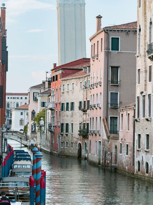 Free Discover the charm of Venice with this picturesque canal view, featuring colorful historic facades and iconic architecture. Stock Photo