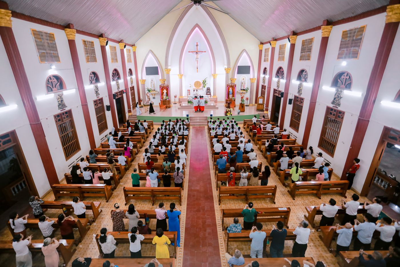 Church congregation gathered for worship in a large sanctuary