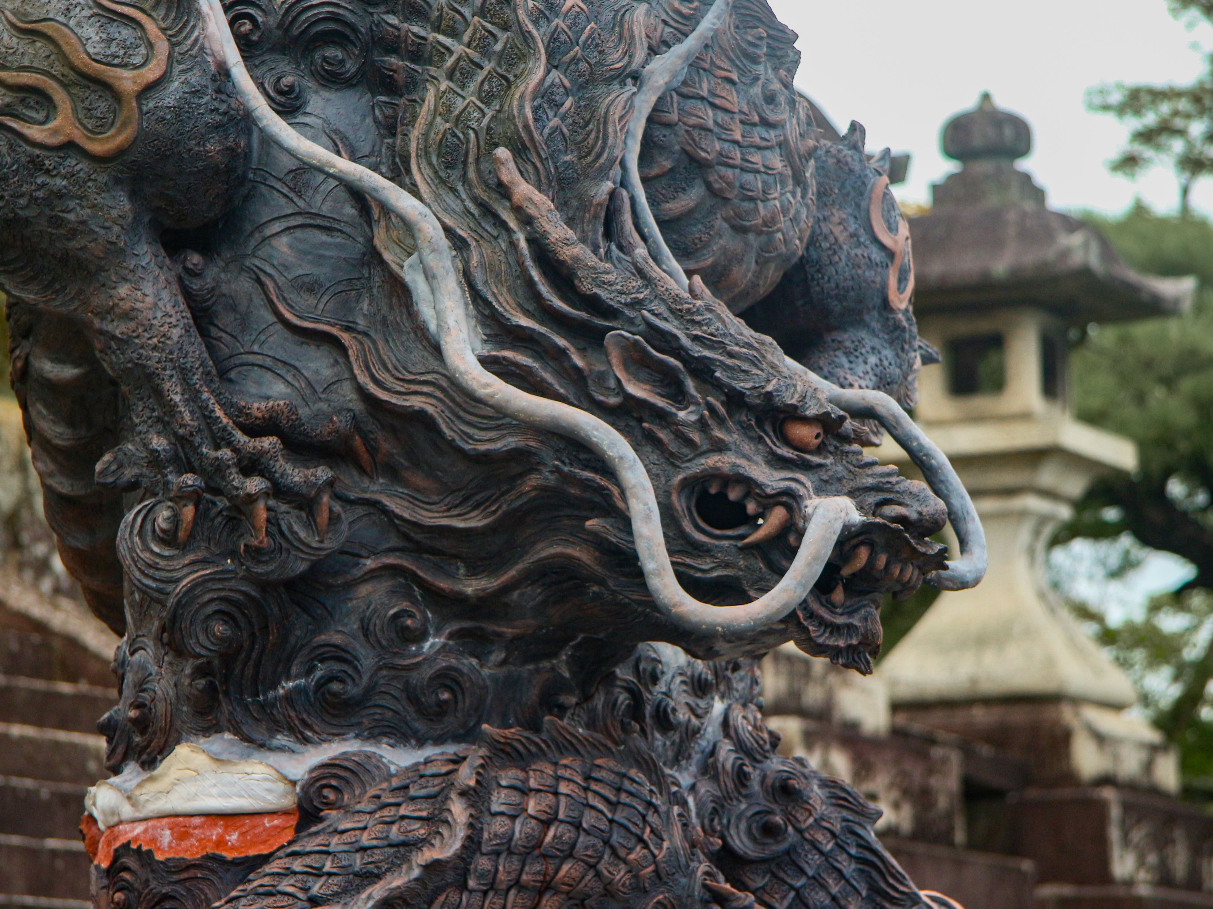 Close-up of an intricate dragon statue showcasing cultural artistry and detail.
